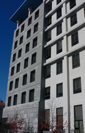 A tall building with many windowsDescription automatically generated with low confidence